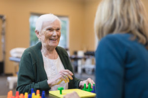 Occupational therapist works with an elderly woman