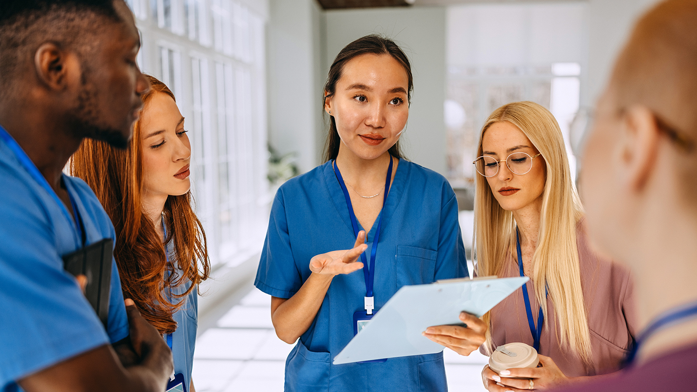 Skilled nursing facility care team discussing abuse, neglect, and exploitation reporting protocols